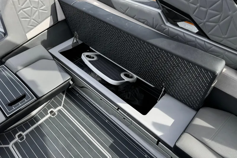 Slide: The Image of 2022 Nautique Super Air Nautique G25 Paragon interior storage compartment with sleek seating design. - 37