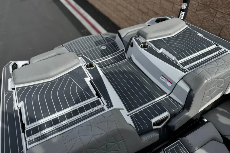 Slide: The Image of 2022 Nautique Super Air Nautique G25 Paragon boat deck with sleek gray seating. - 38