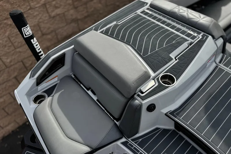 Slide: The Image of 2022 Nautique Super Air Nautique G25 Paragon boat interior with sleek seating and cup holders. - 42