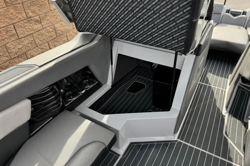 Slide: The Image of 2022 Nautique Super Air Nautique G25 Paragon interior storage compartment and seating area. - 45