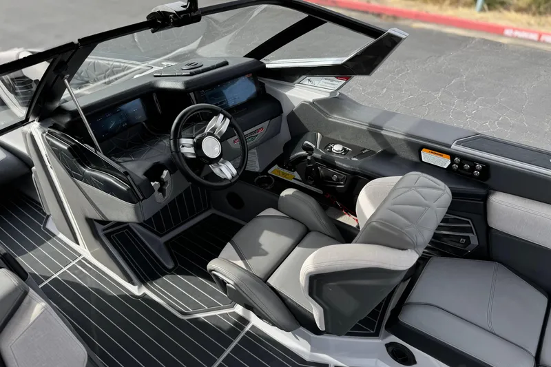 Slide: The Image of Interior of 2022 Nautique Super Air Nautique G25 Paragon boat cockpit. - 48