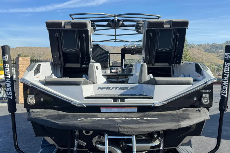 Slide: The Image of 2022 Nautique Super Air Nautique G25 Paragon boat on trailer, scenic background. - 5