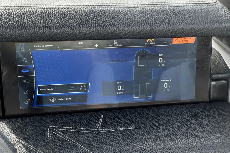 Slide: The Image of 2022 Nautique Super Air Nautique G25 Paragon dashboard display showing ballast settings and circuit fault alert. - 52