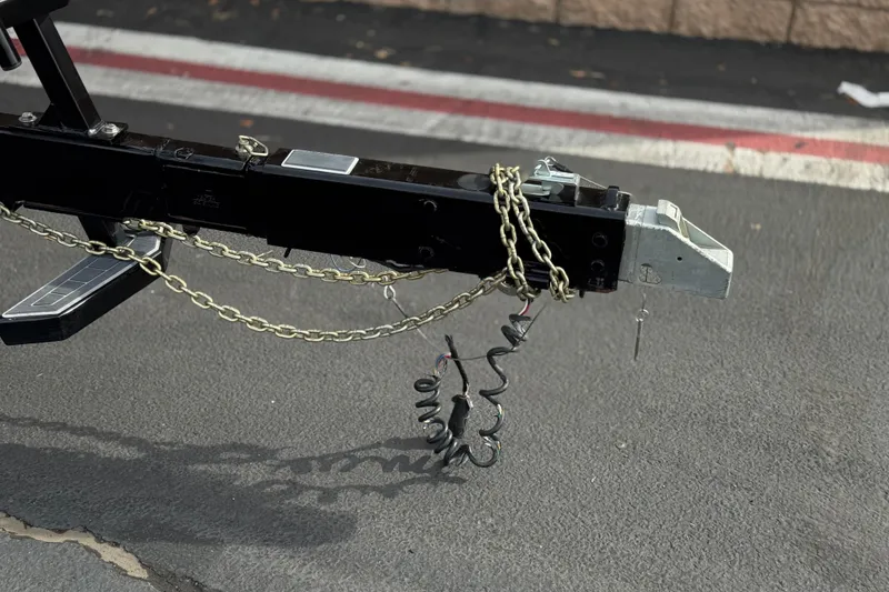 Slide: The Image of Trailer hitch with chains for 2022 Nautique Super Air Nautique G25 Paragon. - 59