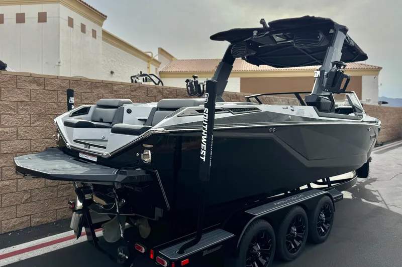 Slide: The Image of 2022 Nautique Super Air Nautique G25 Paragon boat on trailer, parked outdoors. - 7