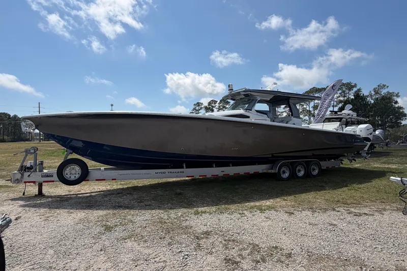 The Image of 2018 Nor-Tech 452 Super Fish boat on trailer under clear sky. - 1