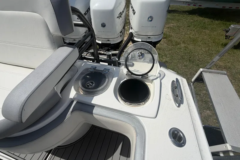 Slide: The Image of 2018 Nor-Tech 452 Super Fish boat with open storage compartments and powerful outboard engines. - 11