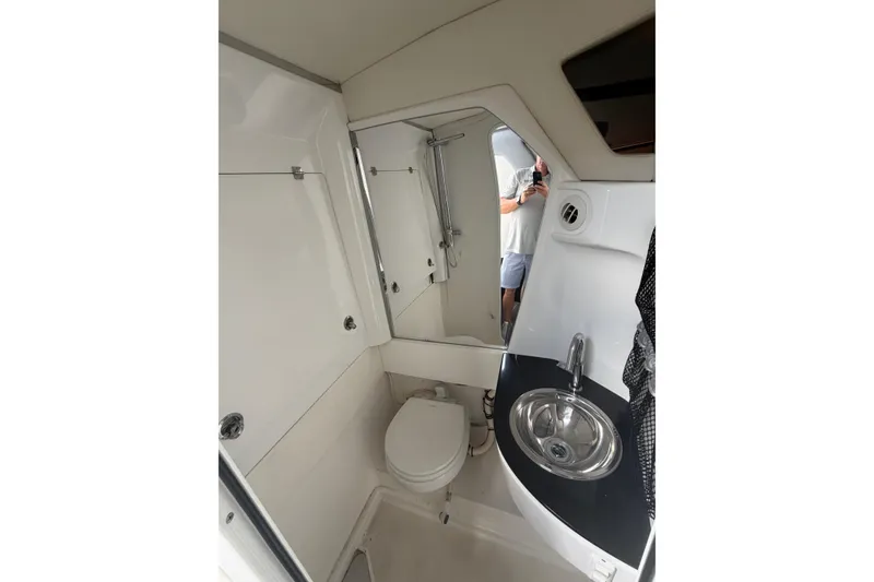 Slide: The Image of Interior of 2018 Nor-Tech 452 Super Fish boat bathroom with sink and toilet. - 17