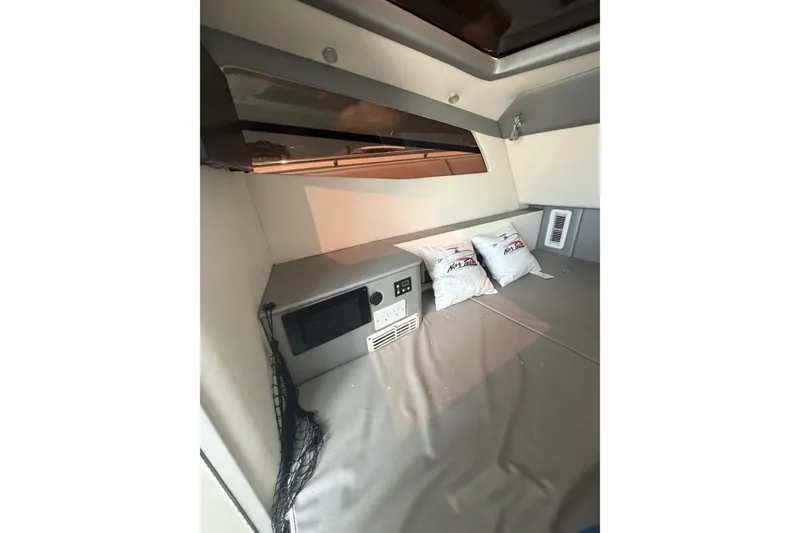 Slide: The Image of Interior cabin of 2018 Nor-Tech 452 Super Fish with cushions and control panel. - 19