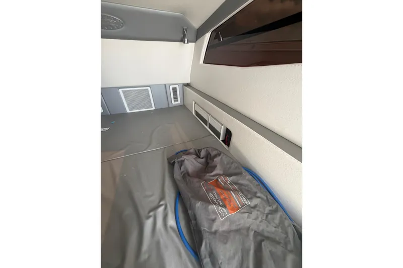 Slide: The Image of Interior cabin of 2018 Nor-Tech 452 Super Fish boat, featuring storage and ventilation. - 20