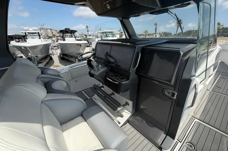 Slide: The Image of 2018 Nor-Tech 452 Super Fish boat interior with modern helm and seating. - 21