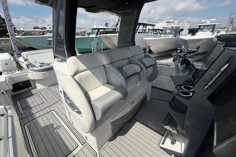 Slide: The Image of 2018 Nor-Tech 452 Super Fish boat interior with luxurious seating and modern dashboard. - 22
