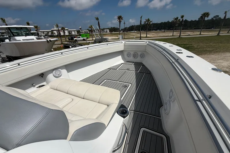 Slide: The Image of 2018 Nor-Tech 452 Super Fish boat interior with white seating and sleek deck design. - 23