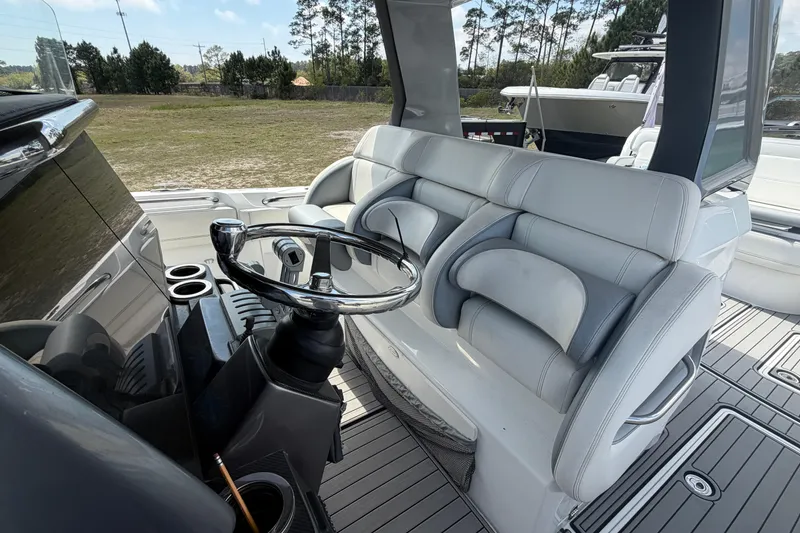 Slide: The Image of 2018 Nor-Tech 452 Super Fish boat interior with steering wheel and seating. - 26