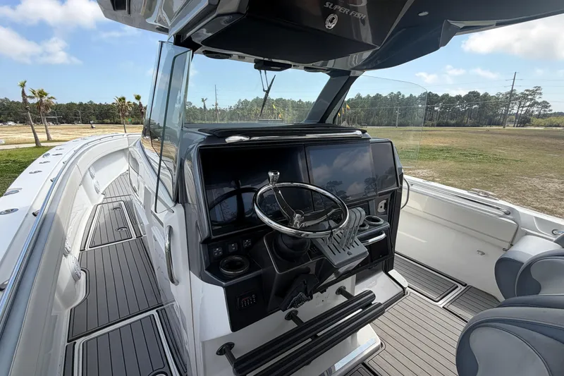 Slide: The Image of 2018 Nor-Tech 452 Super Fish boat cockpit with modern steering and controls. - 27