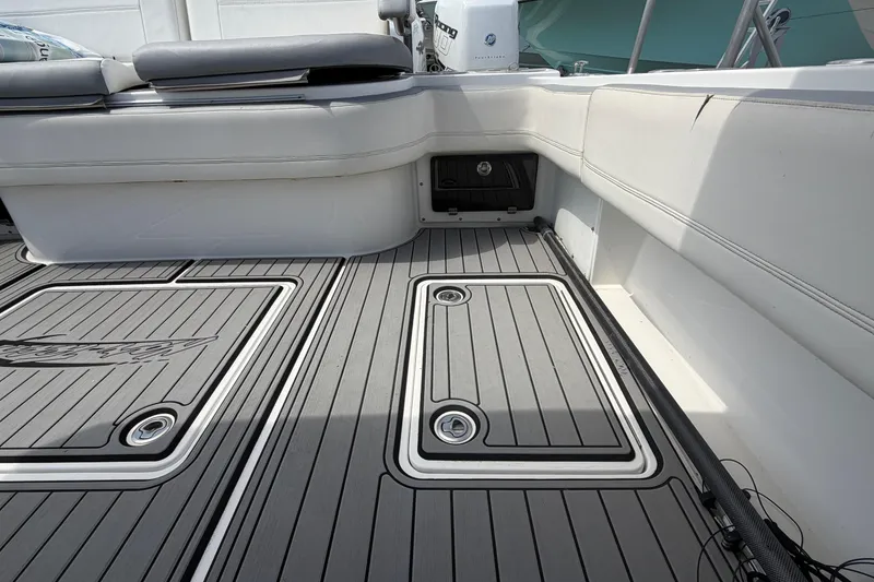 Slide: The Image of 2018 Nor-Tech 452 Super Fish boat interior with cushioned seating and sleek deck design. - 29