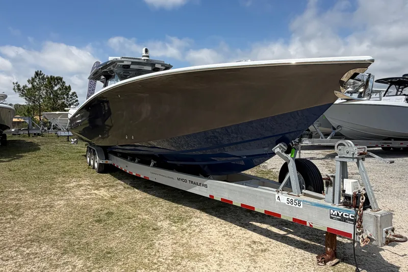 Slide: The Image of 2018 Nor-Tech 452 Super Fish boat on trailer under blue sky. - 3