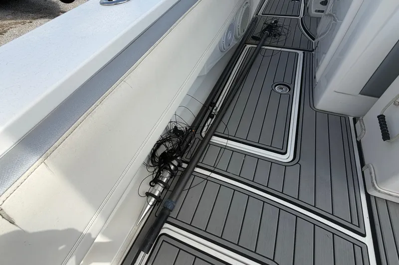 Slide: The Image of 2018 Nor-Tech 452 Super Fish boat deck with fishing rods and gear. - 32