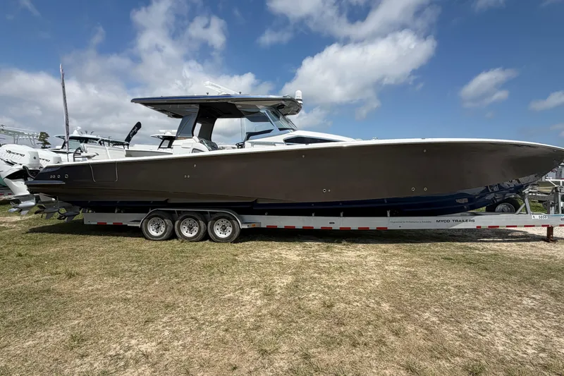 Slide: The Image of 2018 Nor-Tech 452 Super Fish boat on trailer under blue sky. - 5