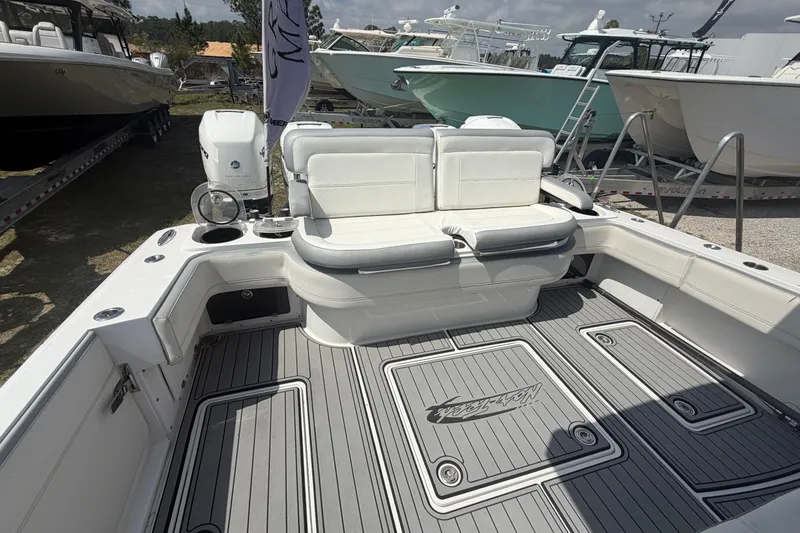 Slide: The Image of 2018 Nor-Tech 452 Super Fish boat interior with cushioned seating and sleek deck design. - 9
