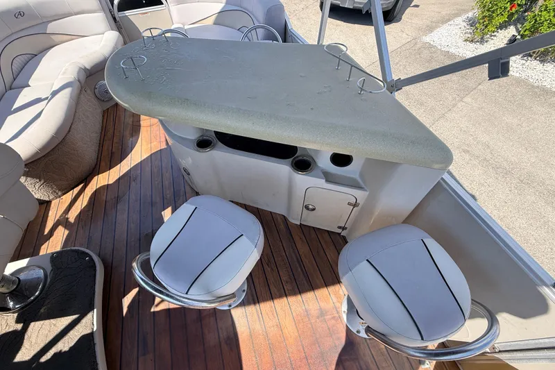 Slide: The Image of 2014 Avalon 2485 Catalina Entertainer boat interior with bar and seating area. - 20