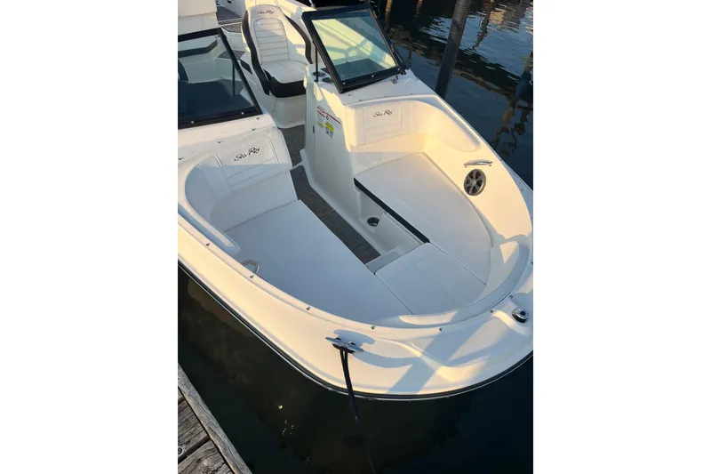 Slide: The Image of 2020 Sea Ray SPX 210 boat interior with white seating and sleek design. - 14