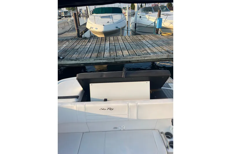 Slide: The Image of 2020 Sea Ray SPX 210 boat docked at marina with wooden pier. - 20