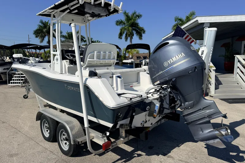 Slide: The Image of 2021 Tidewater 210 LXF boat with Yamaha engine on trailer, parked outdoors. - 10