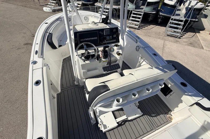 Slide: The Image of 2021 Tidewater 210 LXF boat interior with steering console and seating. - 12