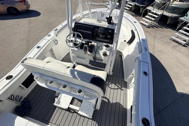 Slide: The Image of 2021 Tidewater 210 LXF boat interior with steering console and seating. - 13
