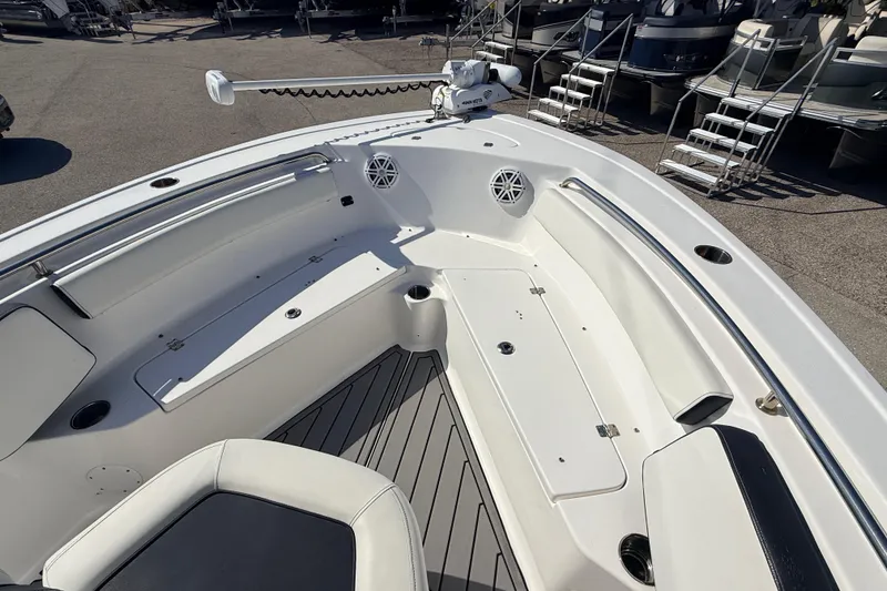 Slide: The Image of 2021 Tidewater 210 LXF boat interior with seating and storage compartments. - 14