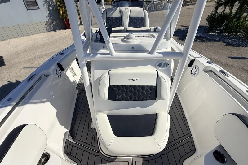 Slide: The Image of 2021 Tidewater 210 LXF boat interior with white seating and sleek design. - 15