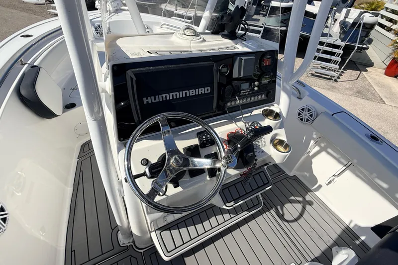Slide: The Image of Center console of a 2021 Tidewater 210 LXF boat with steering wheel and electronics. - 18