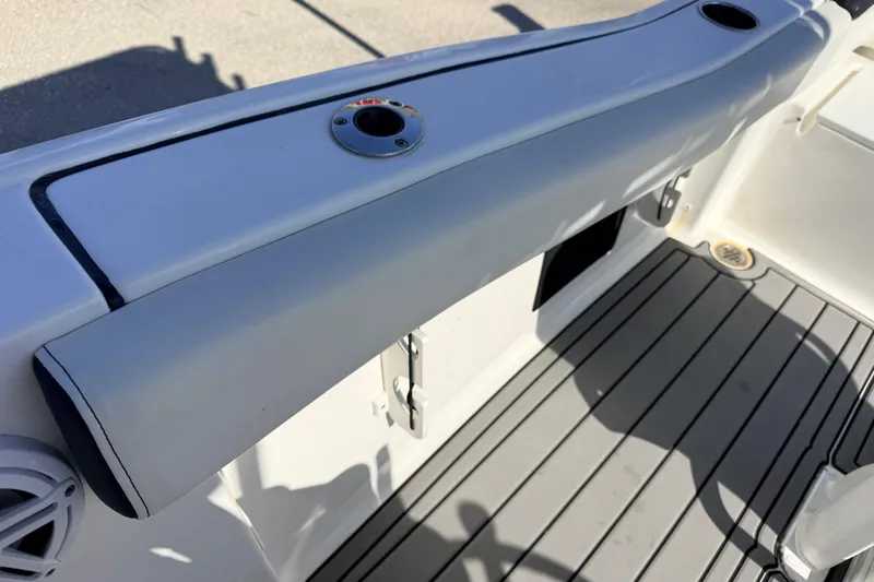 Slide: The Image of Interior view of a 2021 Tidewater 210 LXF boat, featuring sleek seating and flooring. - 22