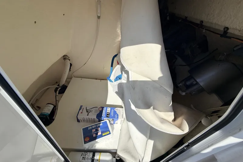 Slide: The Image of Interior of a 2021 Tidewater 210 LXF boat with equipment and first aid kit. - 24