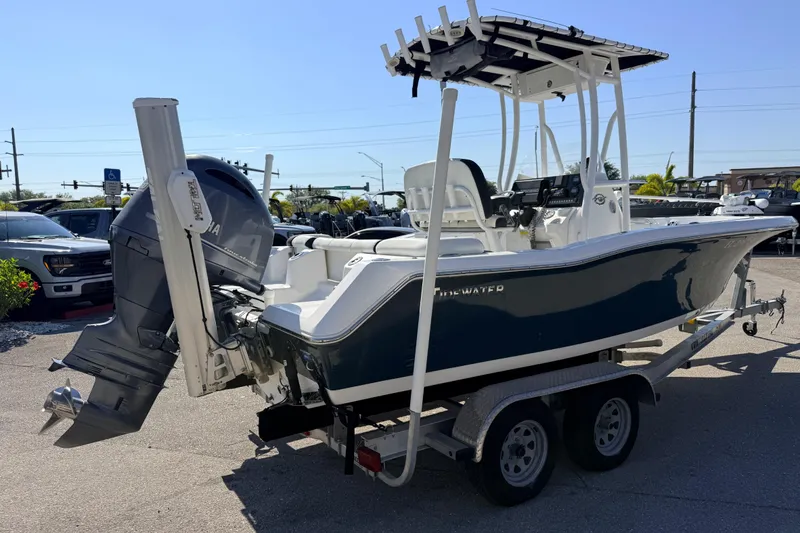 Slide: The Image of 2021 Tidewater 210 LXF boat on trailer, featuring Yamaha outboard motor. - 7