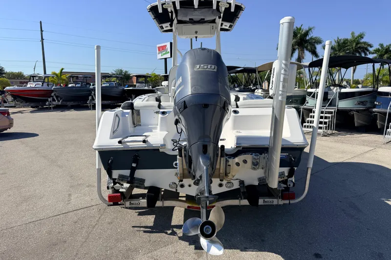 Slide: The Image of 2021 Tidewater 210 LXF boat with Yamaha engine, displayed outdoors in a dealership. - 9