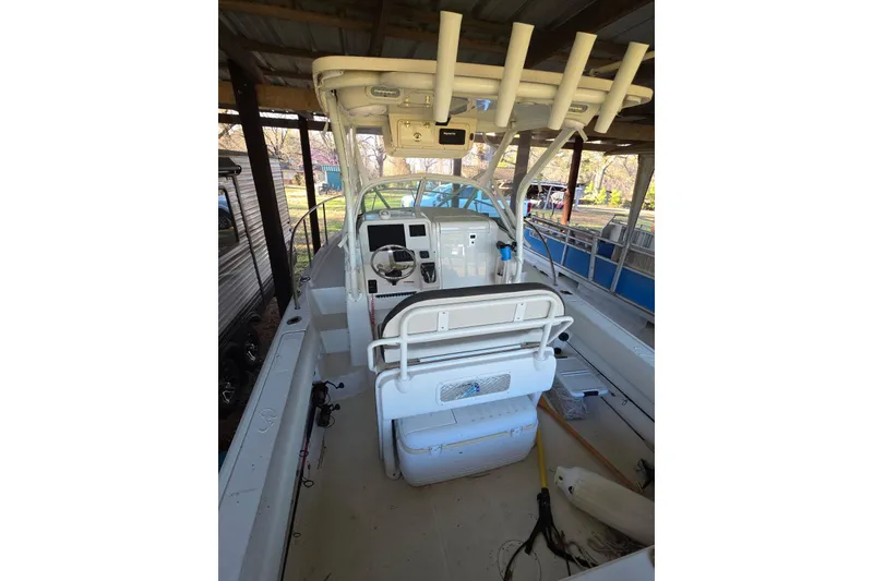 Slide: The Image of Interior view of 2022 Sailfish 220 WAC boat cockpit with steering wheel and electronics. - 12