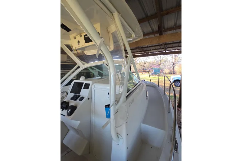 Slide: The Image of 2022 Sailfish 220 WAC cabin interior with open storage compartment. - 16