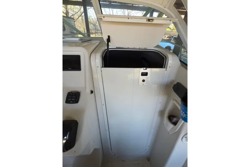 Slide: The Image of 2022 Sailfish 220 WAC boat propeller on gravel surface. - 19