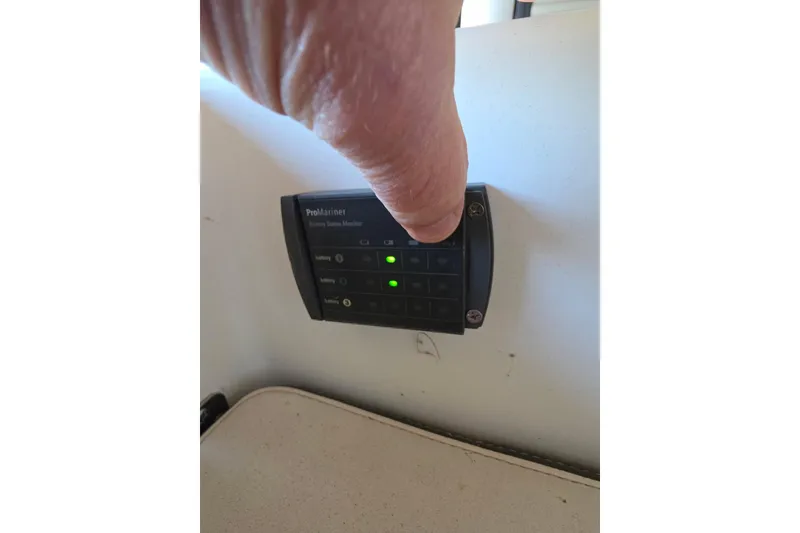 Slide: The Image of 2022 Sailfish 220 WAC boat interior with rod holders and electronic equipment. - 27