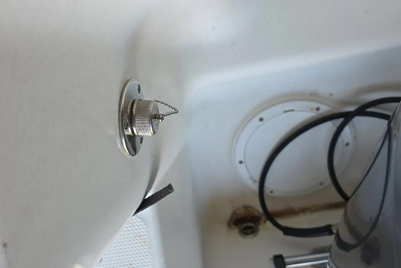 Slide: The Image of Storage compartment in a 2022 Sailfish 220 WAC boat with secured equipment. - 31