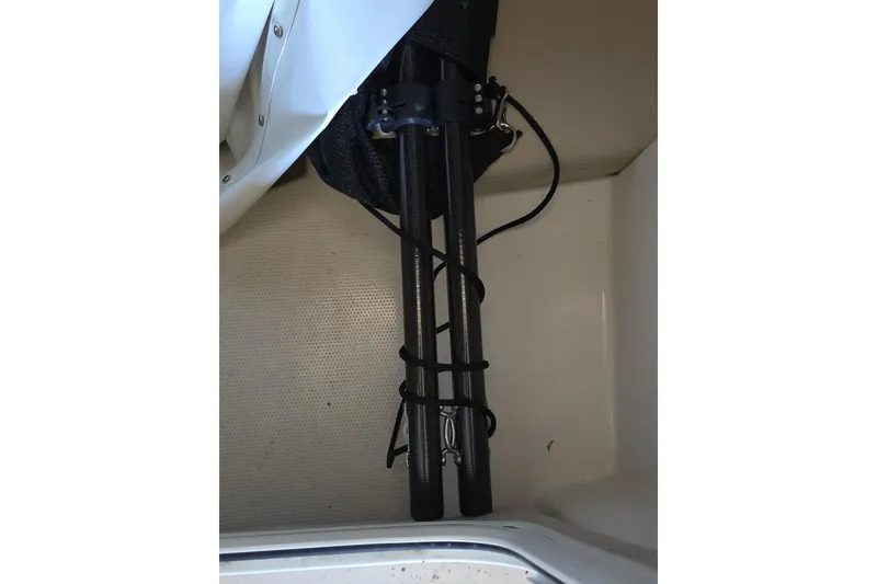 Slide: The Image of 2022 Sailfish 220 WAC boat under a wooden roof structure. - 37