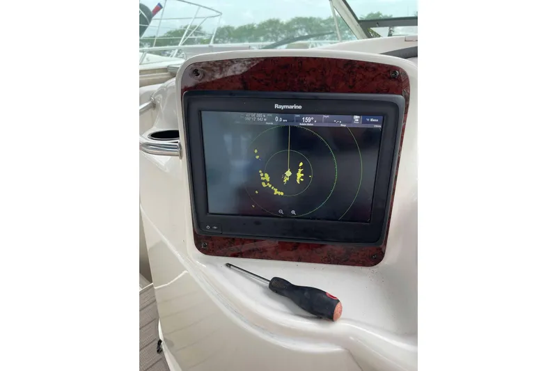 Slide: The Image of Raymarine navigation display on 2001 Sea Ray Sundancer 400 yacht dashboard. - 11