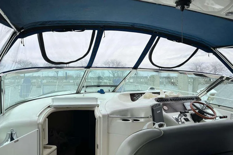Slide: The Image of Interior view of a 2001 Sea Ray Sundancer 400 yacht cockpit with steering wheel. - 12