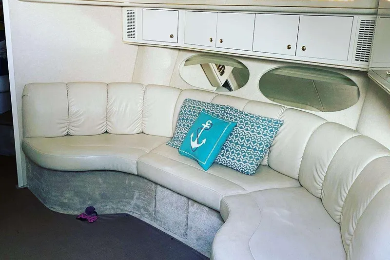 Slide: The Image of Luxurious interior of 2001 Sea Ray Sundancer 400 yacht with plush seating and nautical decor. - 15