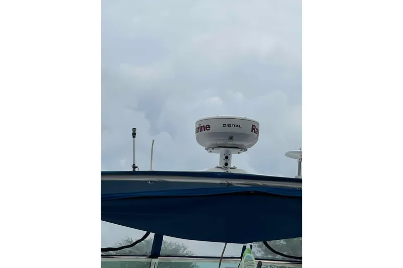 Slide: The Image of Radar equipment on a 2001 Sea Ray Sundancer 400 against a cloudy sky. - 7
