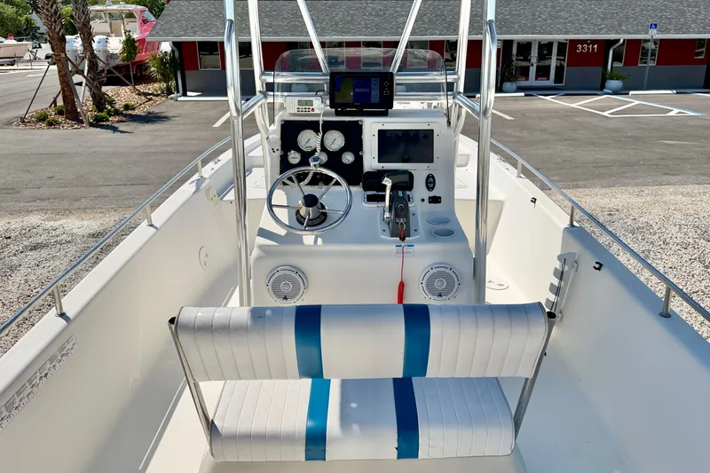 Slide: The Image of 2001 Sea Fox 215 Bay Fisher boat interior with steering console and seating. - 12
