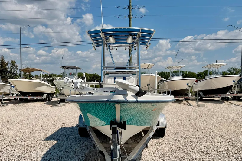 Slide: The Image of 2001 Sea Fox 215 Bay Fisher boat on trailer under blue sky. - 2