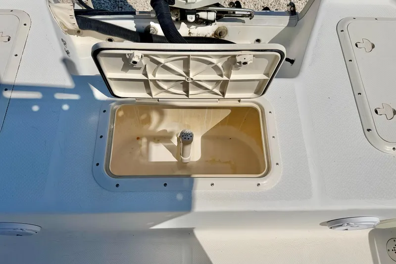 Slide: The Image of Open storage compartment on a 2001 Sea Fox 215 Bay Fisher boat deck. - 22